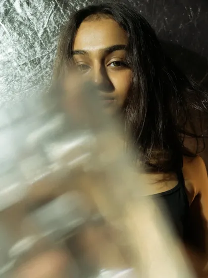 A series of creative headshots using glass and other objects in front of the lens to create distortion and blur. This technique adds an artistic, abstract layer to the portraits.