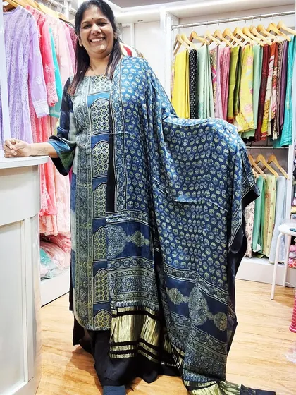 A full-length view of the custom-stitched Ajrakh kurti, showing how beautifully the fabric drapes. We can help you create a similar look.