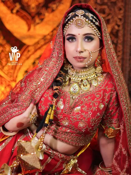 A stunning close-up of a bride wearing one of our most detailed Rajwada sets. Notice the craftsmanship in the oversized necklace, the delicate nath, and the elaborate matha patti, all designed for a royal look.