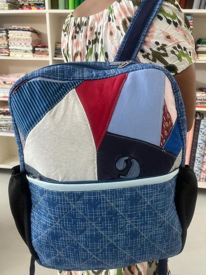 Another angle of the upcycled patchwork backpack, showing off its unique, personalized style.
