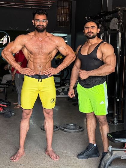 Front pose check. The V-taper is coming in nicely. This is the result of dedicated training.