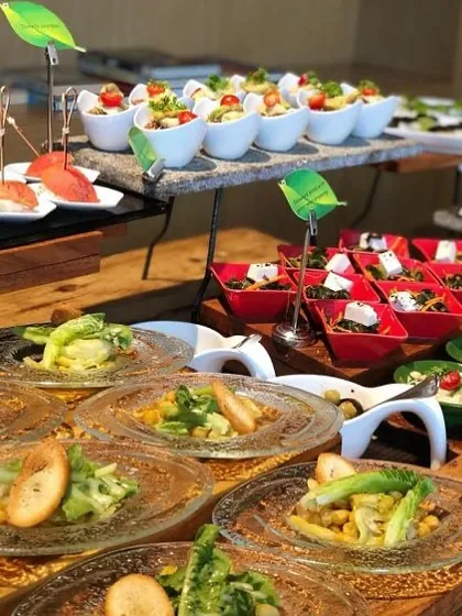 A glimpse of a catering event I hosted, showcasing a variety of fresh, plant-based salads and appetizers. I design spreads that are visually appealing and cater to diverse palates, ensuring every guest feels included.