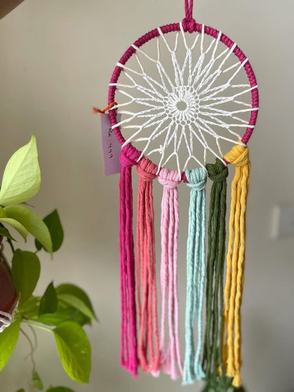 This little unicorn dreamcatcher adds an instant pop of color to any room. It's a perfect mood elevator and a charming piece for a kid's room or a nursery.