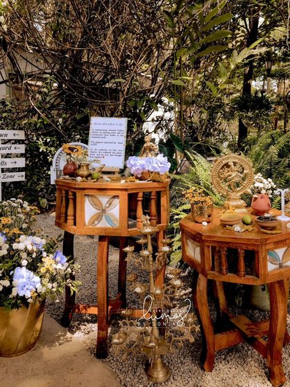 A corner dedicated to the bride and groom's story, with traditional decor elements and floral arrangements.