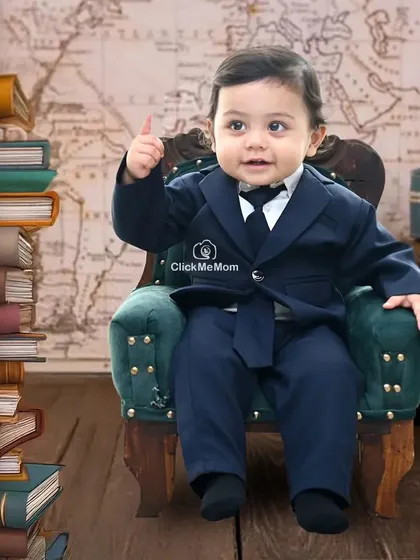 Here is a little boss in the making. This travel-themed 'boss baby' setup is a fun and creative way to capture your toddler's big personality.