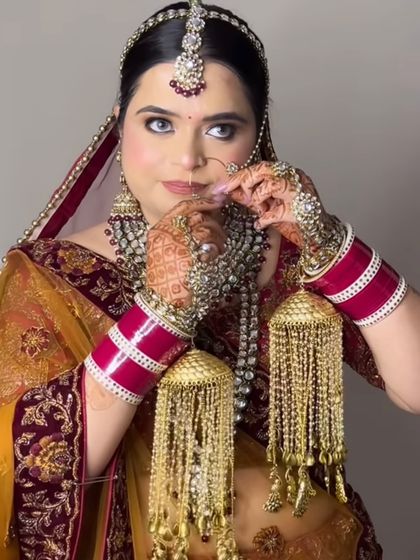 A striking portrait of the bride, her eyes looking directly at the camera.