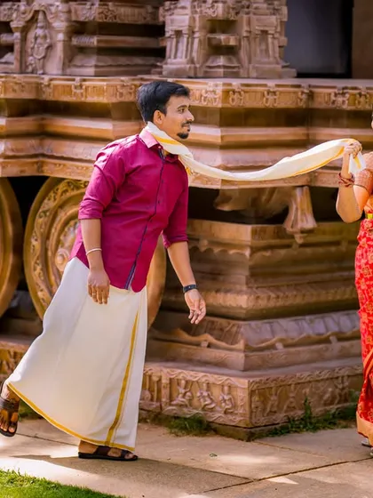 I believe the best moments are the unscripted ones. This playful, candid shot captures the genuine fun and connection between the couple, showcasing their personalities in traditional South Indian attire.