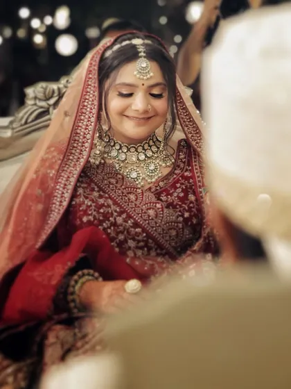 A beautiful moment captured during the wedding rituals. The soft lighting highlights the subtle contouring and highlighting I used to give her face dimension while maintaining a classic bridal feel.