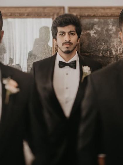A cool, confident portrait of the groom and his groomsmen. The composition and their serious expressions give this a stylish, cinematic feel.