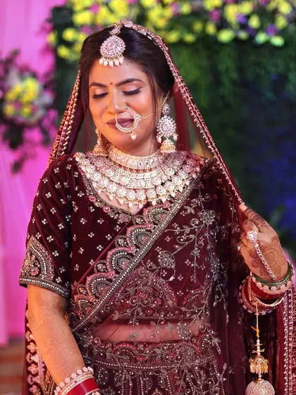 The complete bridal look. The makeup, jewelry, and outfit all work in perfect harmony.