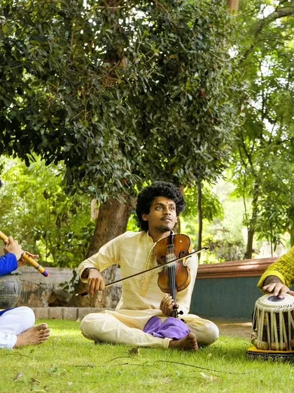 There is a special joy in creating music outdoors with friends. Here I am in a jugalbandi session with Hrishikesh Majumdar on violin and Sumanth Manjunath on flute, blending our instruments together in a beautiful natural setting.
