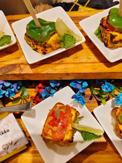 Another look at the Stuffed Paneer Tikka, individually plated and served with a fresh mint dip. This is a popular vegetarian appetizer for weddings and parties.