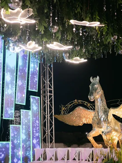 A unique decor element for a Sangeet: a glittering Pegasus statue, adding a touch of fantasy and grandeur.