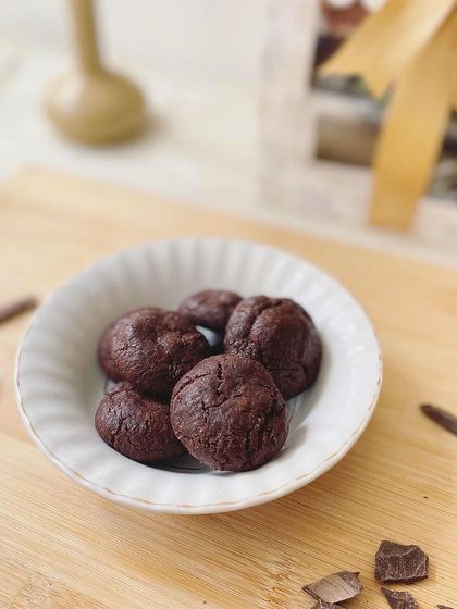 A close-up of our mini double chocolate wheat cookies. These bite-sized treats are eggless and made with whole wheat, perfect for a healthy snack.