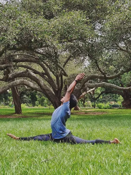 My own practice is a constant exploration. Finding flexibility and strength, like in this Hanumanasana or split, is a journey. I bring the lessons from my personal practice into every class I teach in the park.