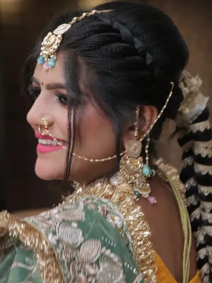 The hairstyle is just as important as the makeup. Here, you can see the detailed Punjabi braid, or 'parandi', a key element we teach for this style.