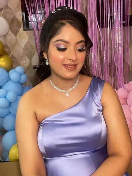 A close-up of the soft, shimmery eye makeup. The look is elegant and perfect for the occasion.