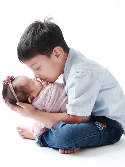 Welcoming a new baby is a milestone for the whole family. Capturing the gentle curiosity and instant love of an older brother meeting his newborn sister for the first time is a story I am always honored to tell.
