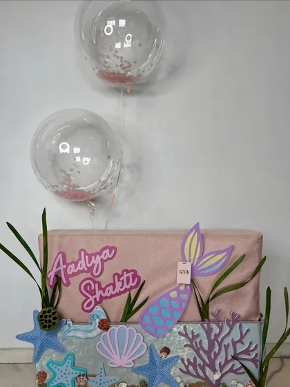 The complete mermaid hamper, with confetti-filled balloons adding a touch of celebration to this enchanting underwater-themed gift.