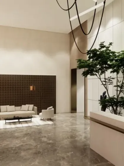 Greenery is a key feature in this lobby design. Tall plants and decorative trees bring life and freshness to the space, complementing the natural materials used in the reception desk and wall panels.