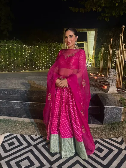 A bright and cheerful pink and green lehenga for a festive night. I love playing with color combinations in Indian wear to create a look that’s both traditional and fun.