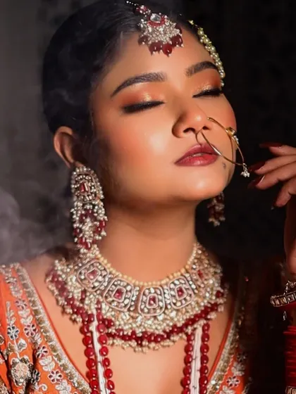 A close-up showing the delicate nath and the warm, glowing makeup. The look is glamorous yet feels soft and romantic, perfect for a Nikkah ceremony.