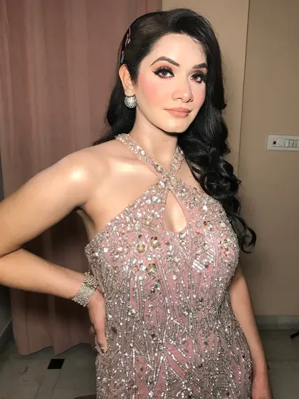 This engagement bride is ready to shine in her pink sequined gown, paired with simple but elegant diamond jewelry.