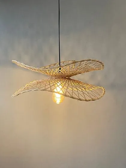 A beautiful pendant light made from woven bamboo or rattan. This fixture casts a warm, patterned light and adds a natural, airy feel to the room.