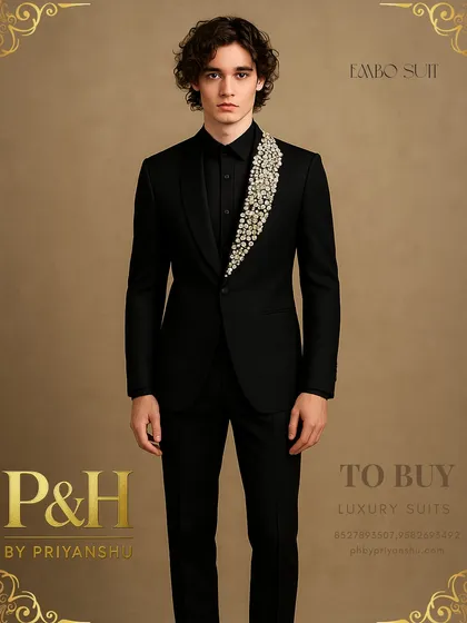 A portrait shot of the black party suit, highlighting the striking contrast between the sharp tailoring and the sparkling, handcrafted lapel.