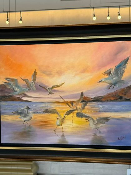 A beautiful painting of seagulls by the shore at sunset, another piece from Rashmi Soni's 'Serenity' collection.