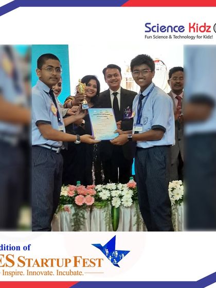 The award ceremony at the NES Startup Fest, where our students are receiving their trophy and certificate on stage. This is a powerful moment of recognition for their hard work.