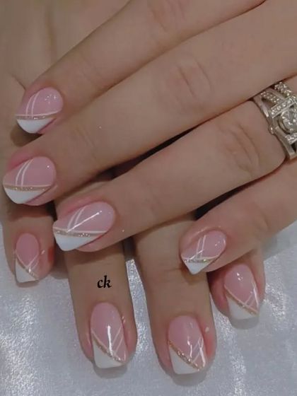 A close-up of this geometric French design, showing the clean lines and glitter detail.