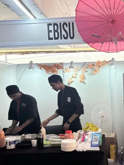 Our chefs at an outdoor event, bringing the art of Japanese cuisine to the community. Their dedication to precision and quality is the same, whether in our restaurant or at a pop-up.