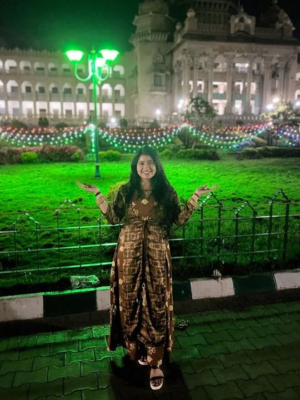 In front of the beautifully lit Vidhana Soudha in Bengaluru. I find inspiration everywhere, from nature to the stunning architecture of the cities I call home.