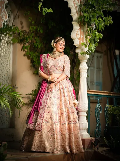 A beautiful full-length shot of the bride in a picturesque setting, showing how the entire look comes together with elegance and poise.