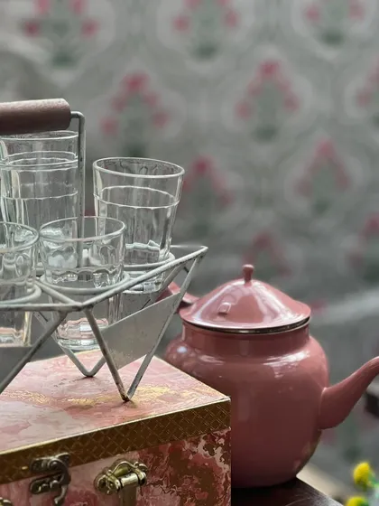The classic cutting chai glasses and pink teapot that are part of our nostalgic and beloved chai station setup.