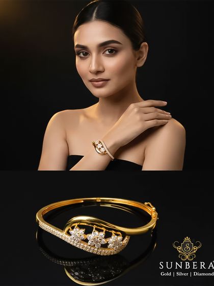 A stunning gold and diamond kada, perfect for the modern woman. The design features a flowing, leaf-like motif studded with diamonds, combining clean lines with a touch of nature-inspired elegance.