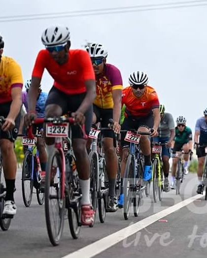 A group of elite riders, including one from the well-known team, The Bike Affair, compete at the front.