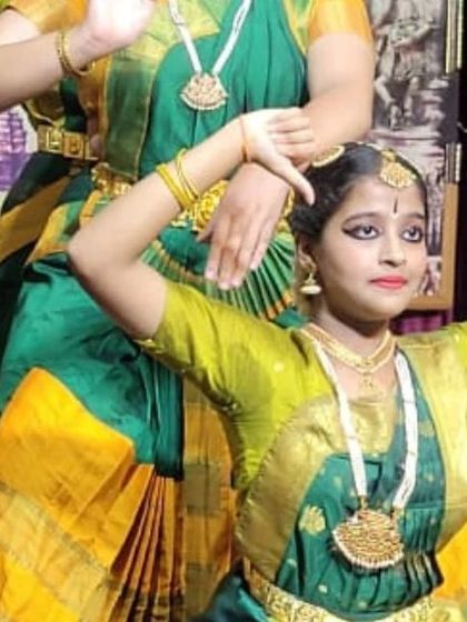 A close-up of my students' graceful postures during the Navaratri performance.