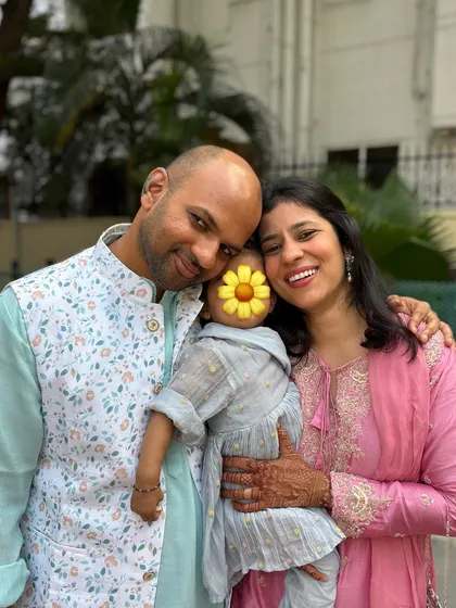 A sweet family photo. We are coordinating in pastel shades of pink and blue, showing how family outfits can be harmonious without being identical.