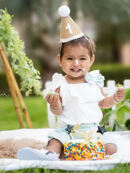 Let's make a mess. A first birthday cake smash is all about fun, and this outdoor session was full of sweet smiles and even sweeter treats.