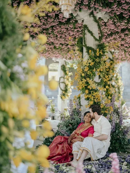 Nithya and Payton's ceremony was a beautiful blend of two cultures, set amidst clouds of fresh flowers in the Nandi Hills. Our team of specialized florists worked for days on-site to bring this floral paradise to life.