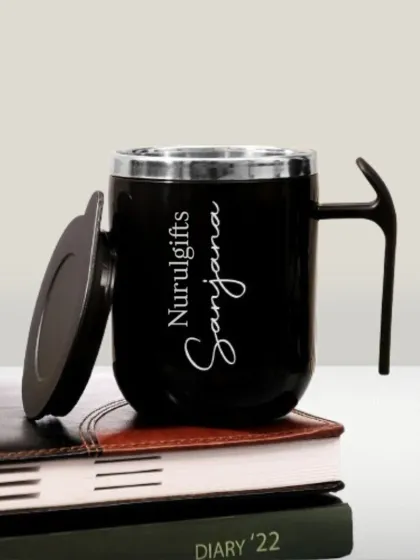 A personalized stainless steel coffee mug with a lid, engraved with a name. A great gift for coffee lovers.
