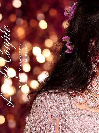 A detail shot from a Punjabi couple's wedding album, focusing on the bride's intricate jewelry and hairstyle. The soft bokeh background adds a touch of glamour and romance.