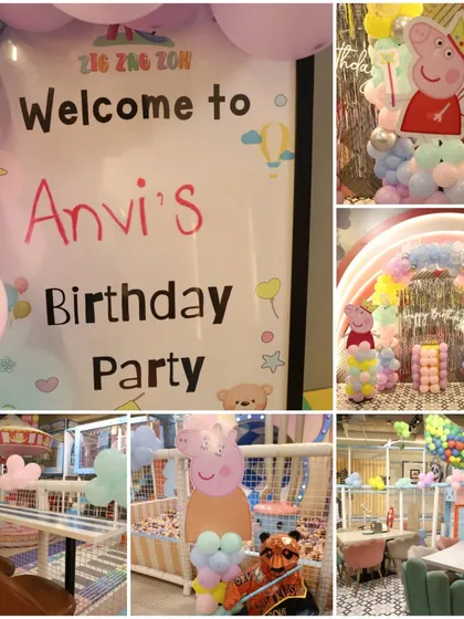 A sweet and cuddly Peppa Pig themed birthday party! The decorations include character balloons and a personalized welcome sign for the birthday girl, Anvi.