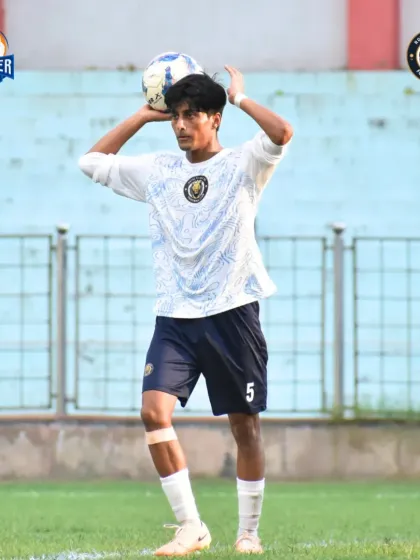 A player prepares for a throw-in, a crucial moment to restart play and build an attack.