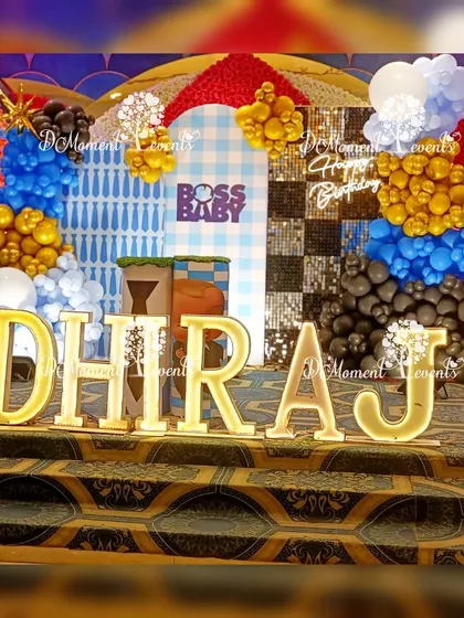 A close-up of the Boss Baby stage, highlighting the marquee letters and the detailed, multi-panel backdrop that creates a high-energy, celebratory feel.