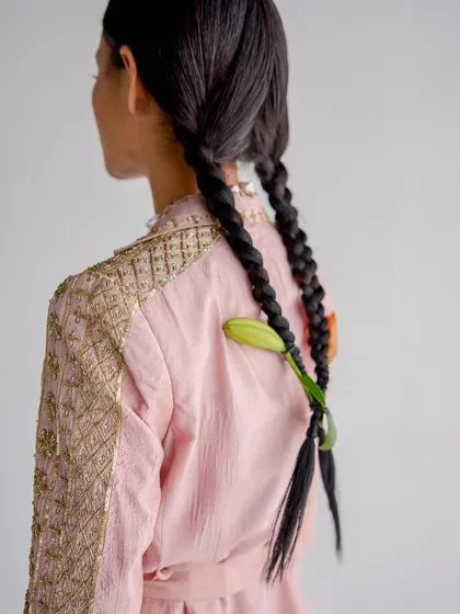 Another hair detail from the same shoot, this time weaving a lily bud into twin braids. These small touches are what elevate a look.