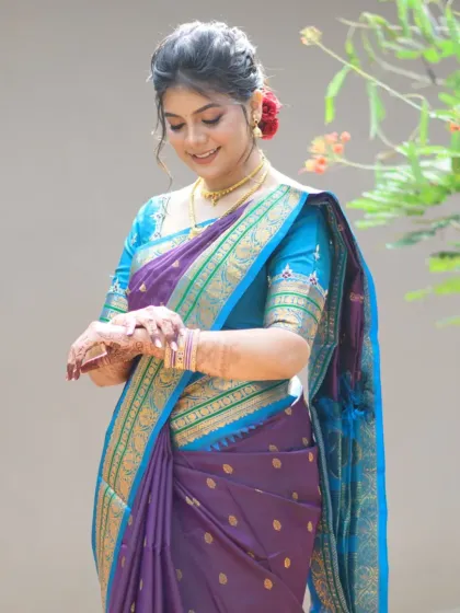 Another beautiful shot of the bride, highlighting the flawless makeup and the intricate details of her henna design.