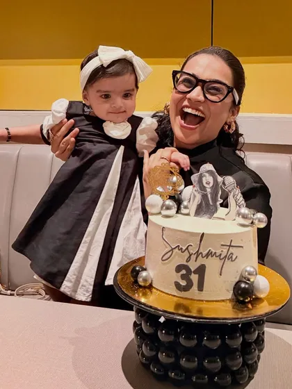 Another happy moment from my 31st birthday celebration. My joyful expression and Gauri's cute presence make this a lively and engaging photo.